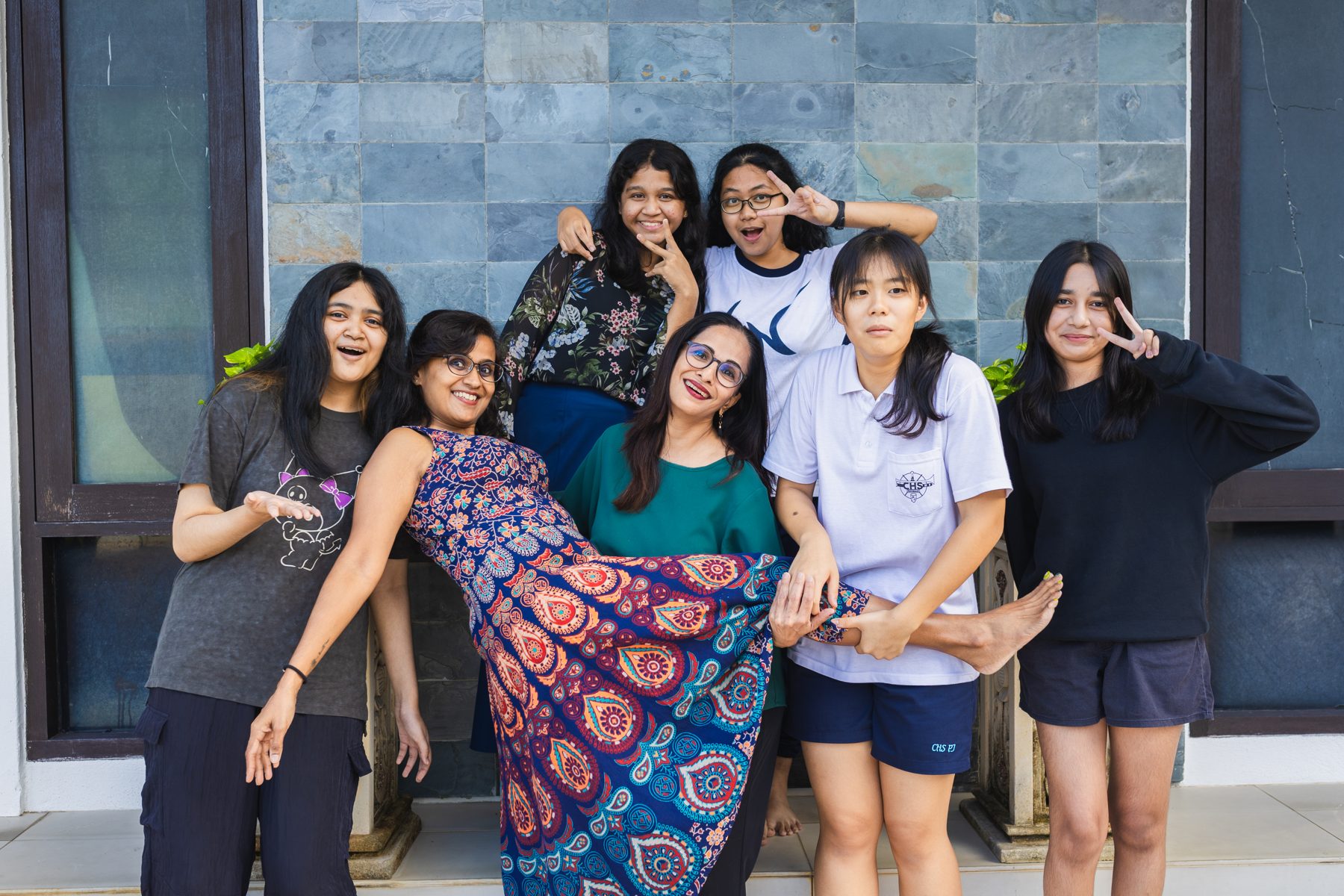 Happy Epic Smart students celebrating together with their teacher