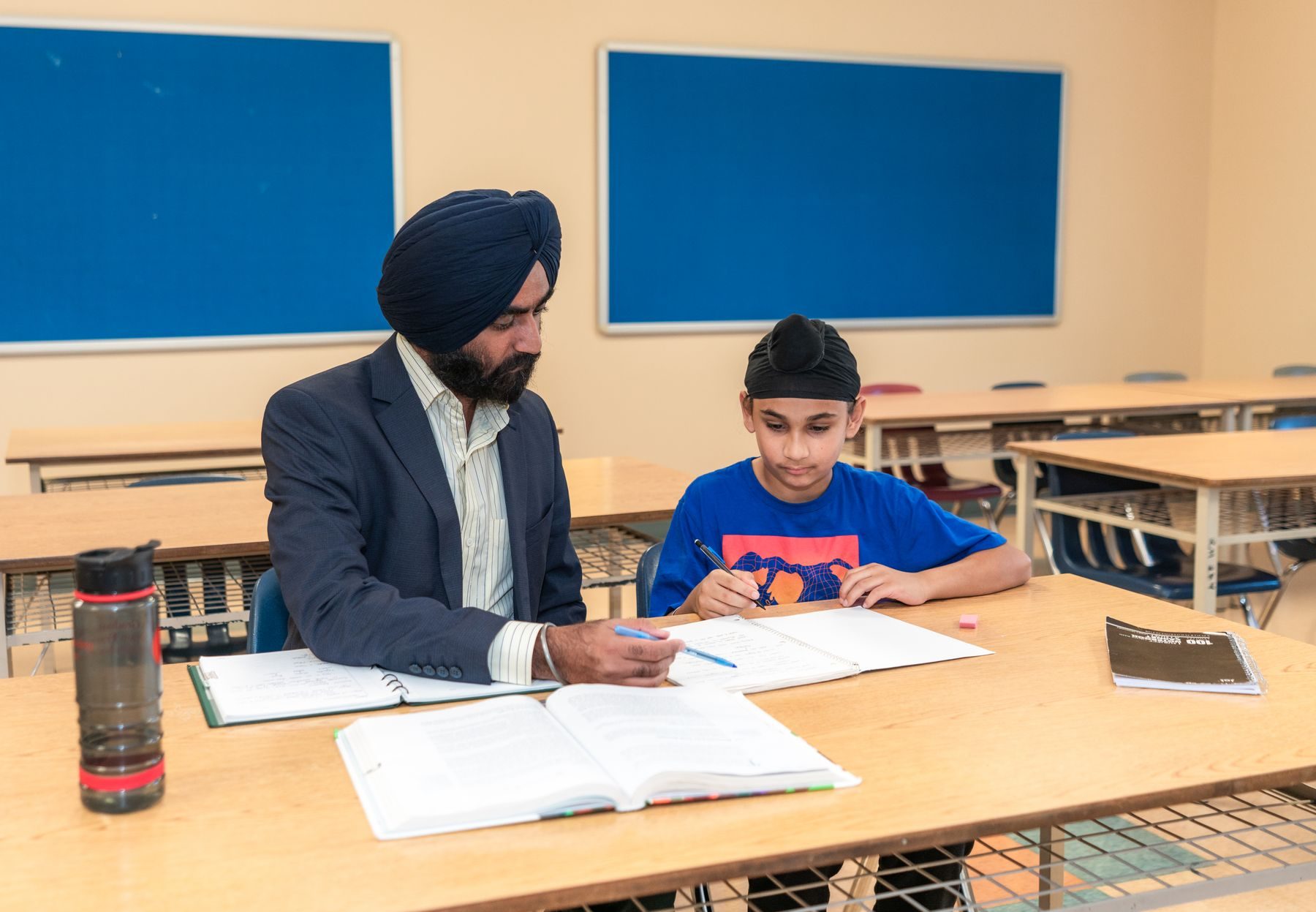 A teacher giving a student patient one-to-one support at Epic Smart Academy in Bangsar